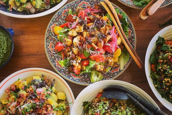 A table laid with a colourful array of Sophie's salads and dishes from Lemon and Mint