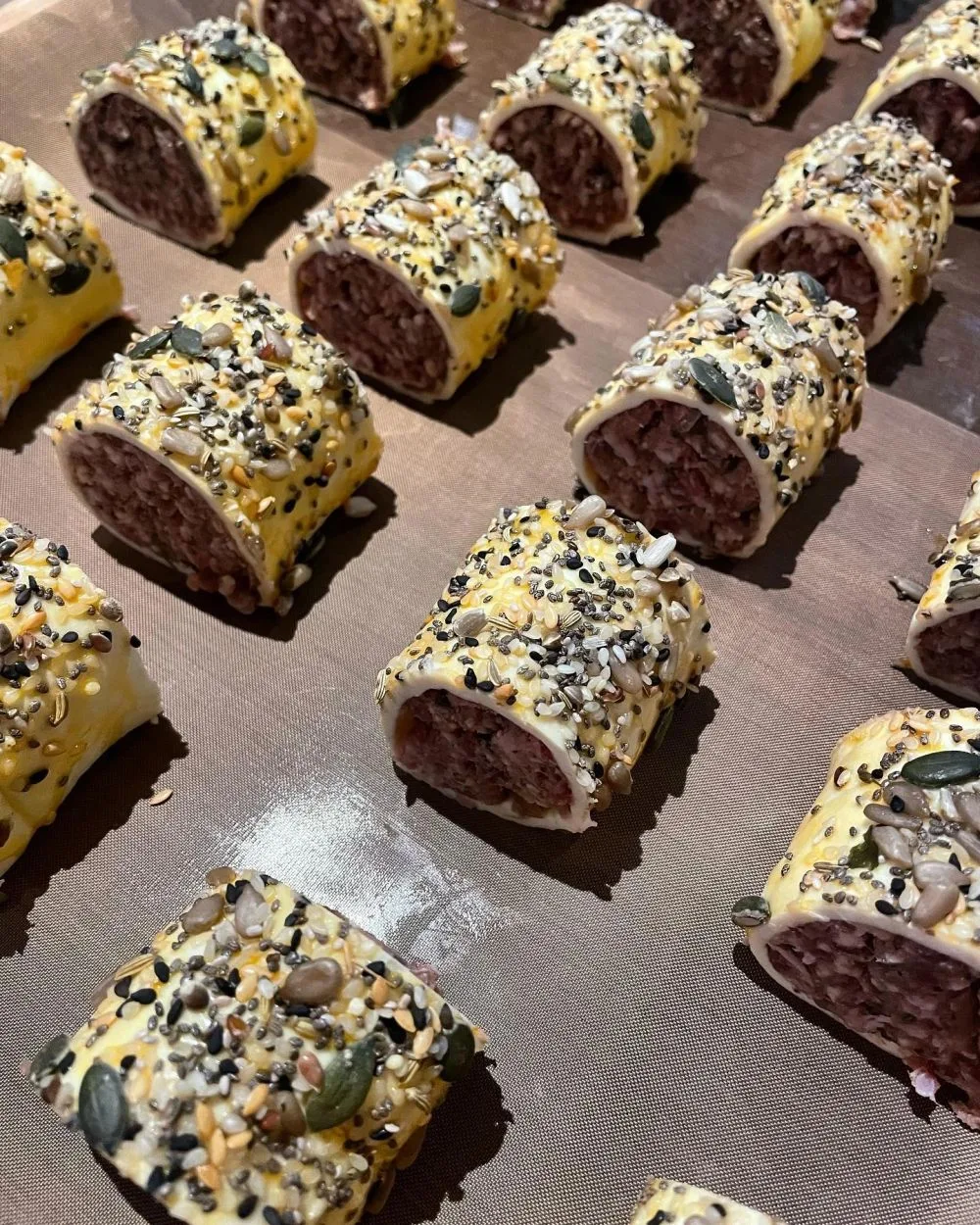 Seeded, herb-rolled canapés