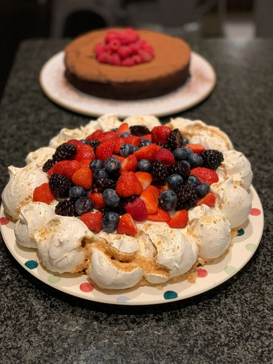 A summer pavlova piled with berries