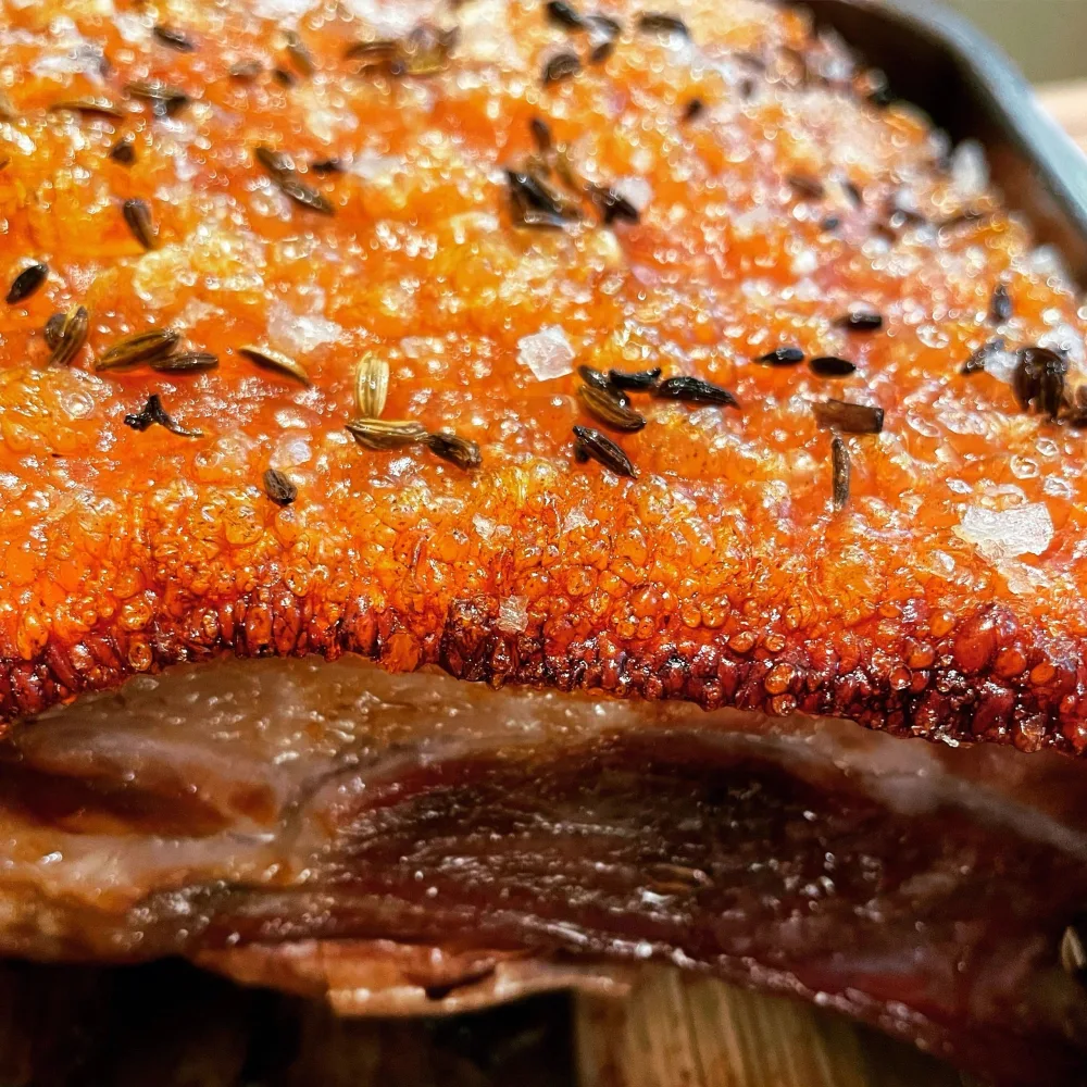Slow-roasted pork belly with crisp, fennel-flecked crackling