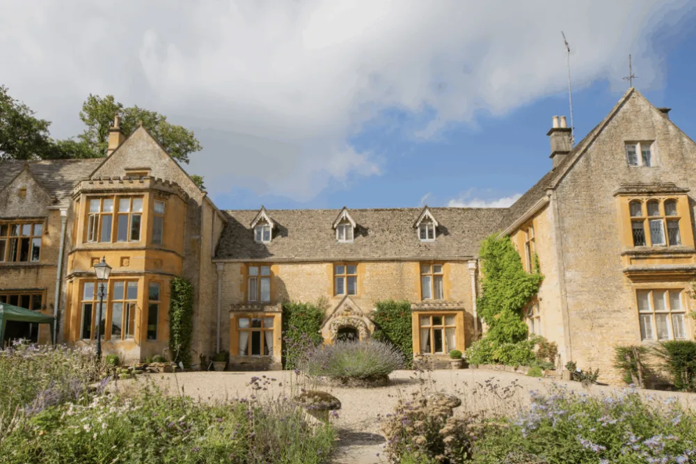 Lords of the Manor, the honey-stone country house at Upper Slaughter, seen across its gardens