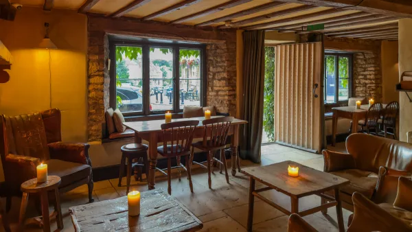 The candlelit interior of The Bull, Charlbury