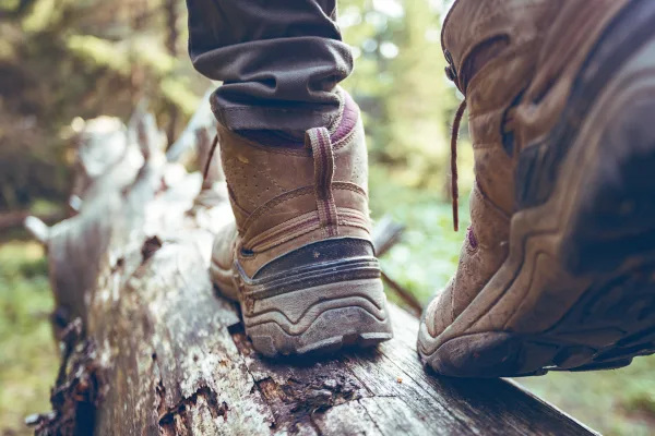 Walking boots on a grassy field path near Well Cottage, Ledwell