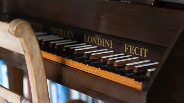 The Morley spinet keyboard in the library, gilt lettering on dark walnut