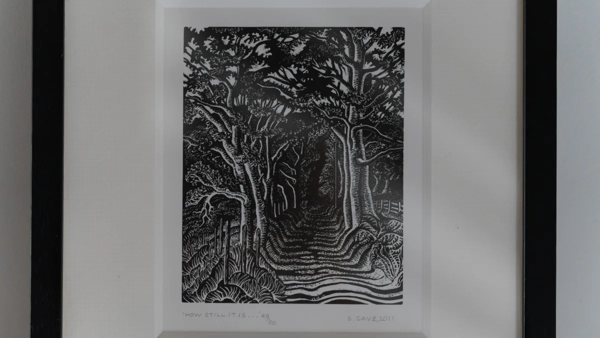 A close view of the wood engraving titled 'How still it is', hand-numbered and signed S. Cave, 2011 beneath the image